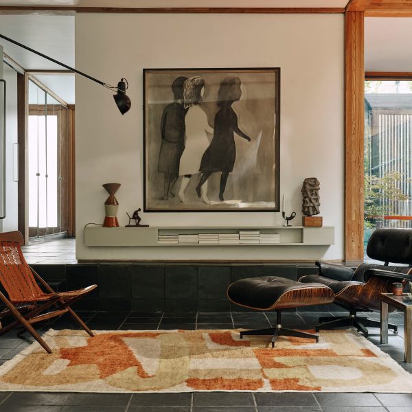Photo of living room with leather chairs on a Christopher Farr rug