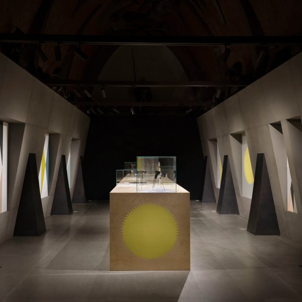 Photo of dark room with a cube-shaped table in the centre