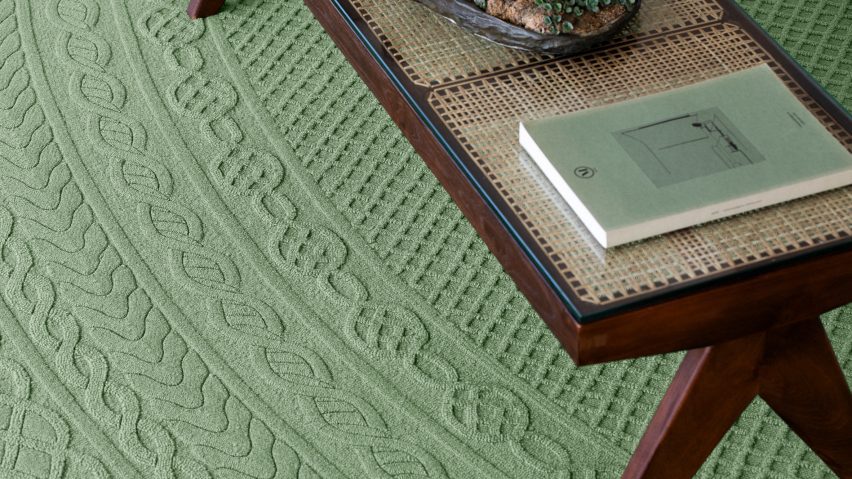 Photo of green carpet with wooden coffee table