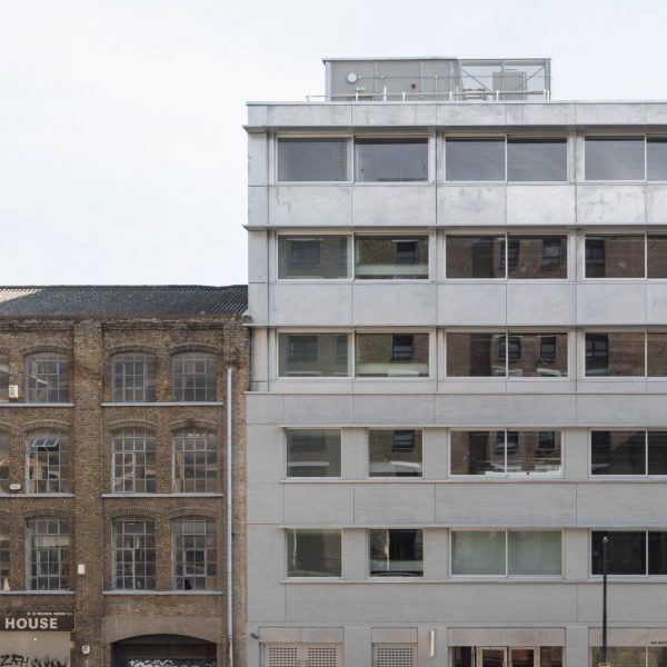 Steel extension on top of grey brick warehouse