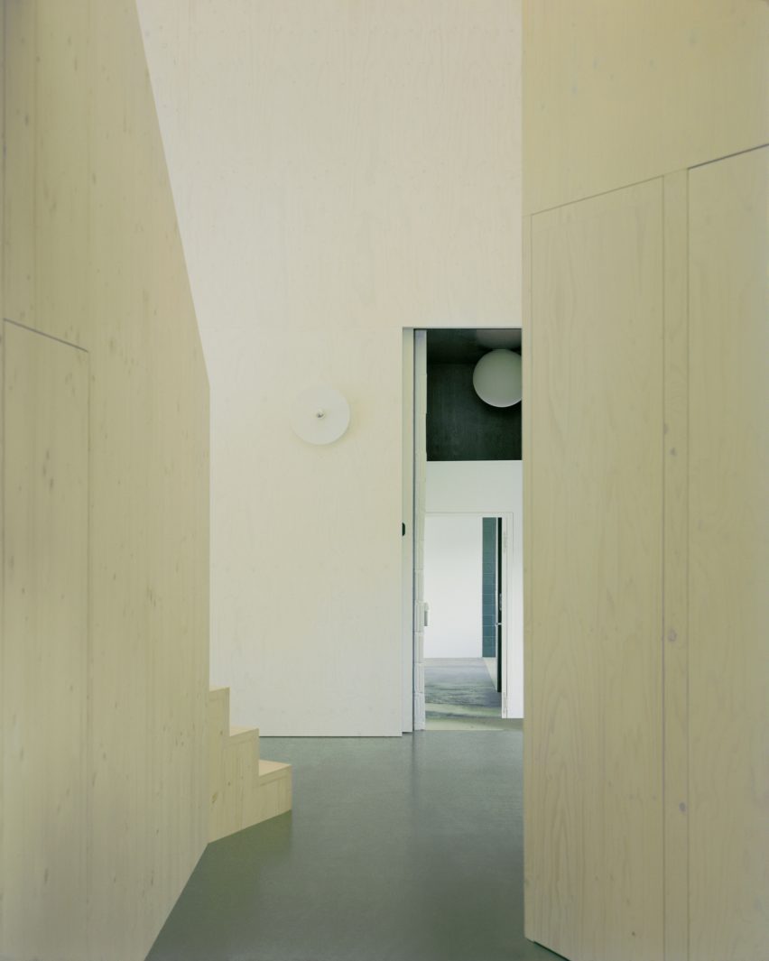 Plywood staircase inside multigenerational home