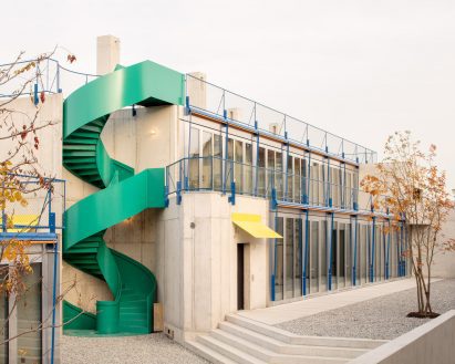 Courtyard area with spiral staircase at concrete residences