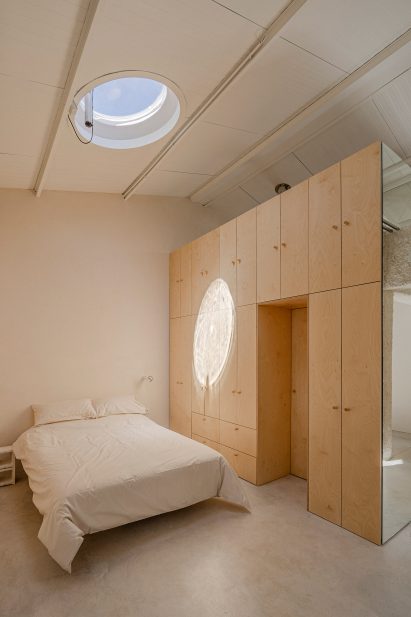 Bedroom interior at Madrid warehouse conversion by Burr Studio