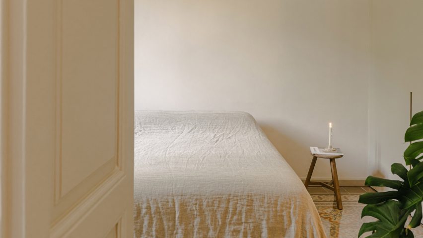 Bedroom with rice paper lamp and plant