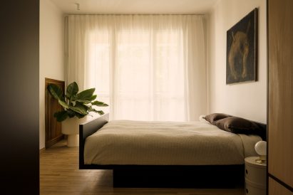 Neutral-hued bedroom in a mid-century apartment in Warsaw