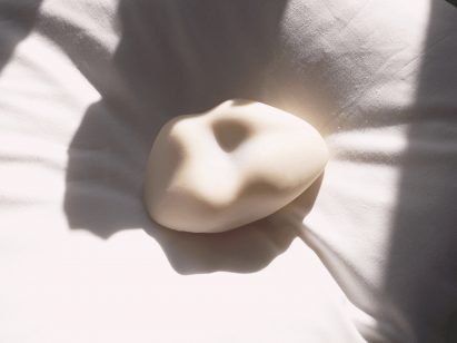 a photograph of a sex toy in tones of white