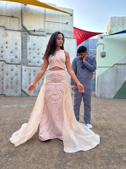 one person in a pink dress and another in blue garments
