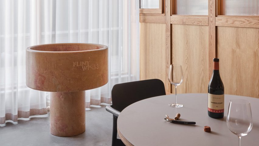 Giant spittoon shaped like baptismal basin decorates London office of wine merchant Flint