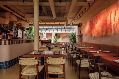 Laposse's diaphanous fabric hanging adorns the full length of the main wall