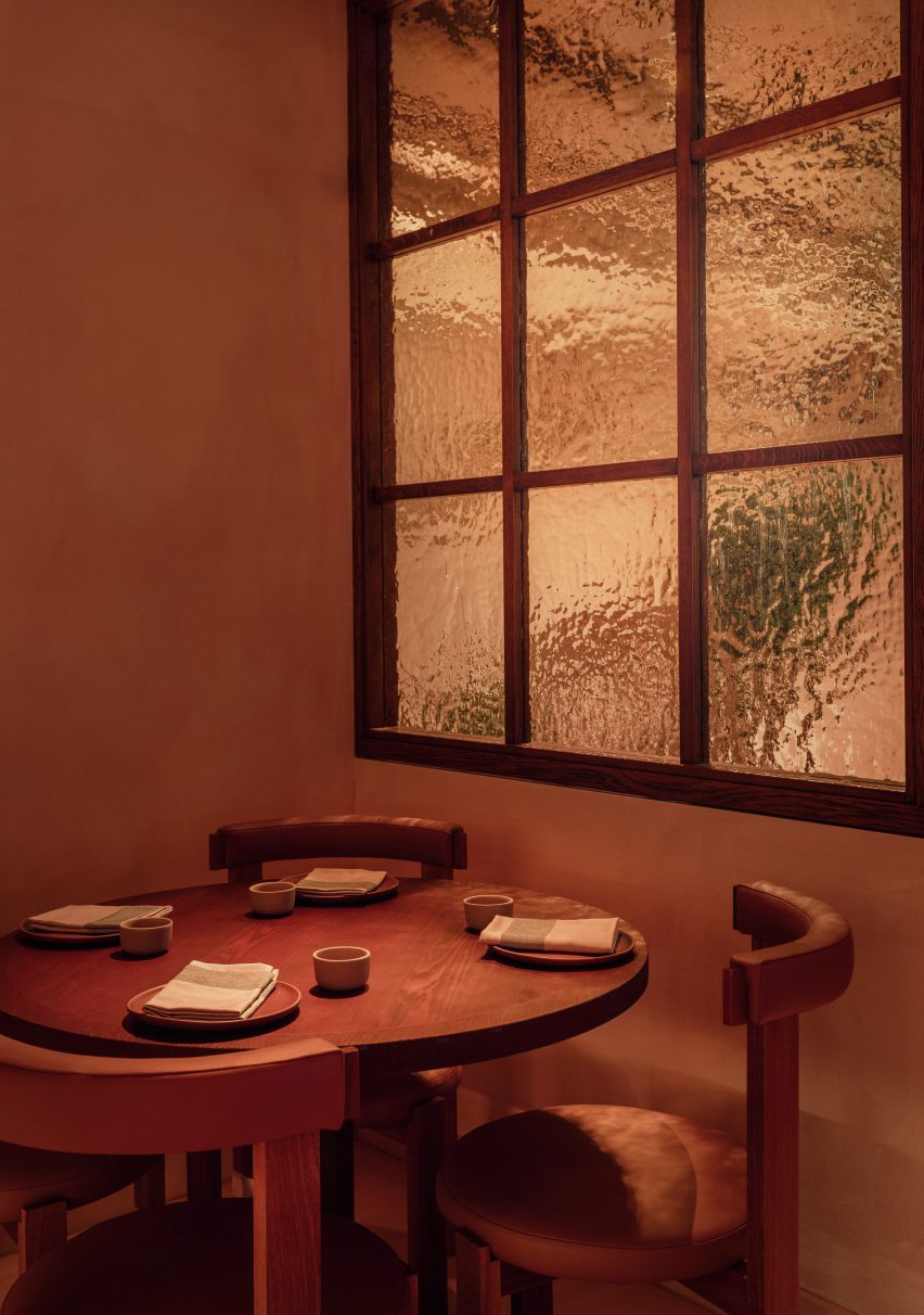 table and chair by rippled glass panel