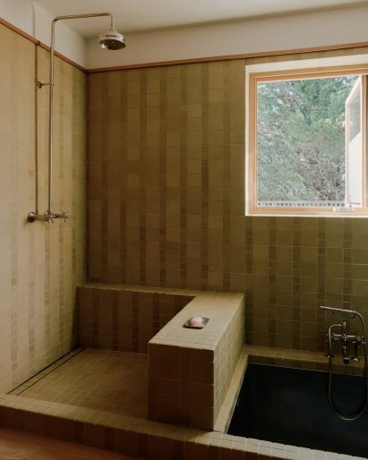 Bathroom with sunk steel bath