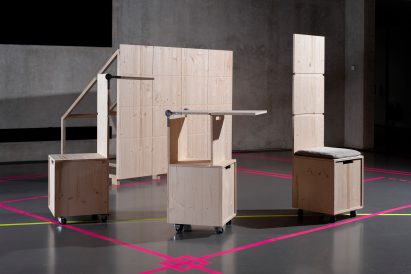 a photograph of wooden structures in an exhibition