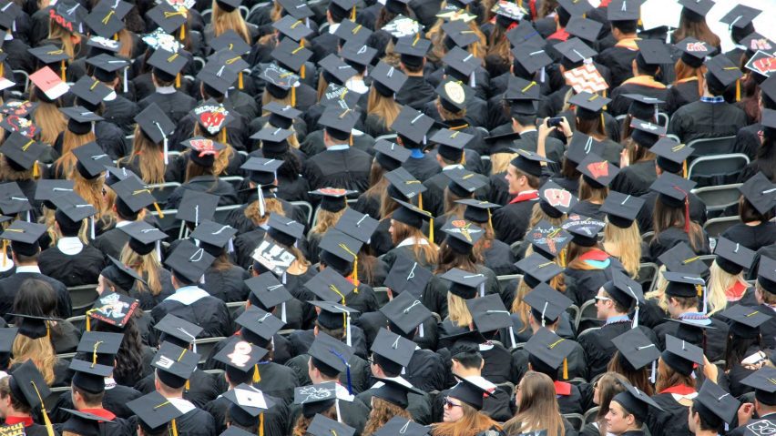 Sea of university graduates in mortar-boards