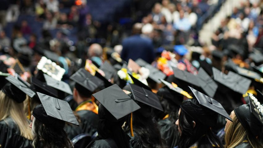 Students sitting down for a graduation ceremony