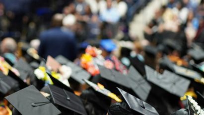 Students sitting down for a graduation ceremony
