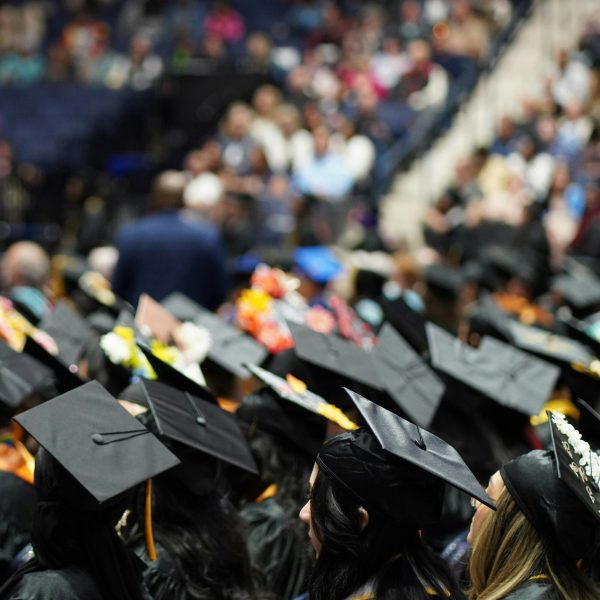 Students sitting down for a graduation ceremony