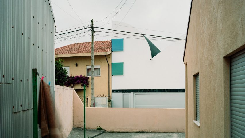 A House with an Inverted Roof by Fala Atelier