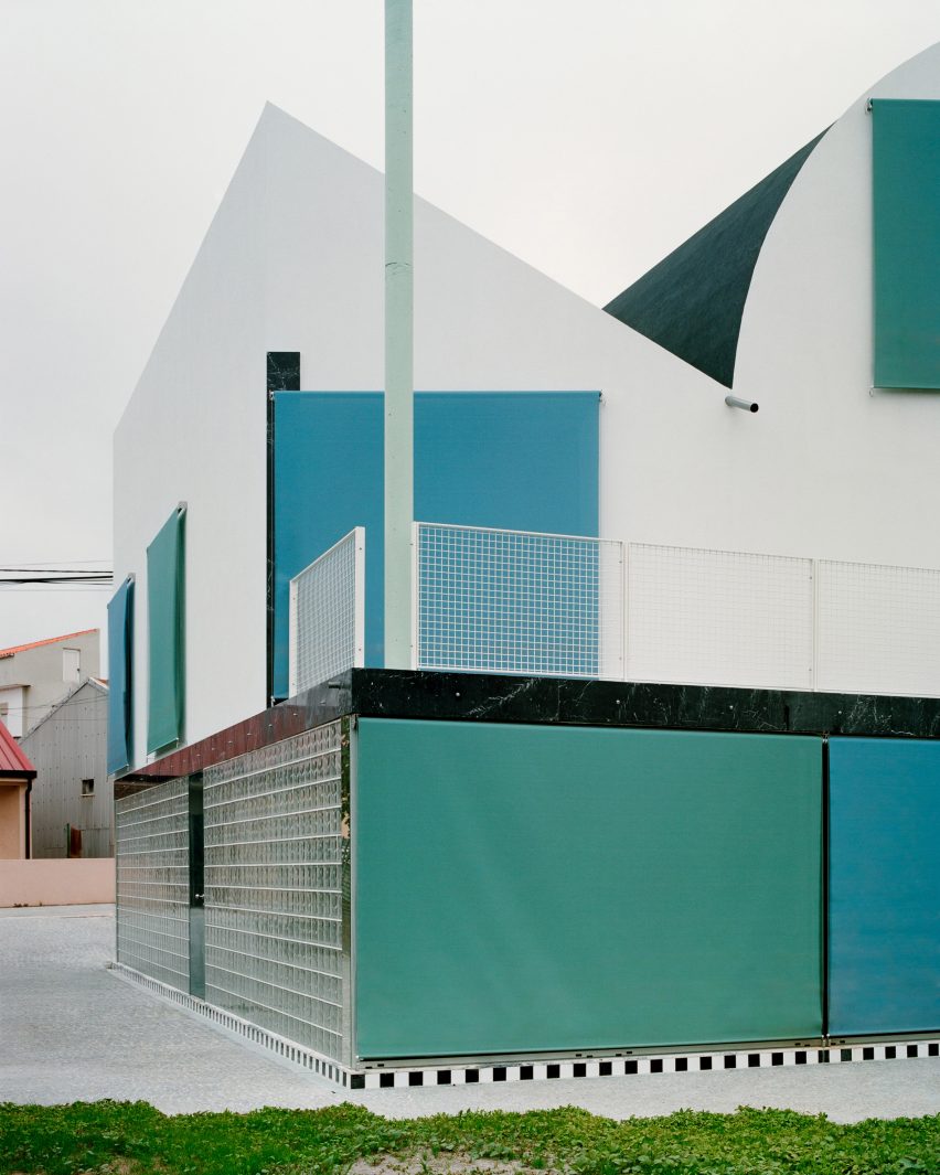 A House with an Inverted Roof by Fala Atelier