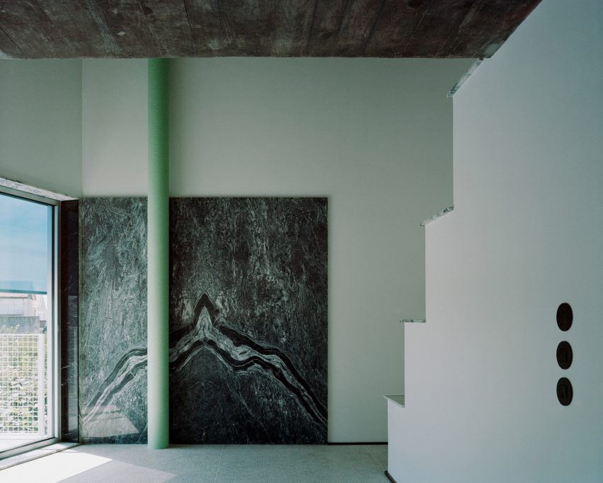 A House with an Inverted Roof by Fala Atelier