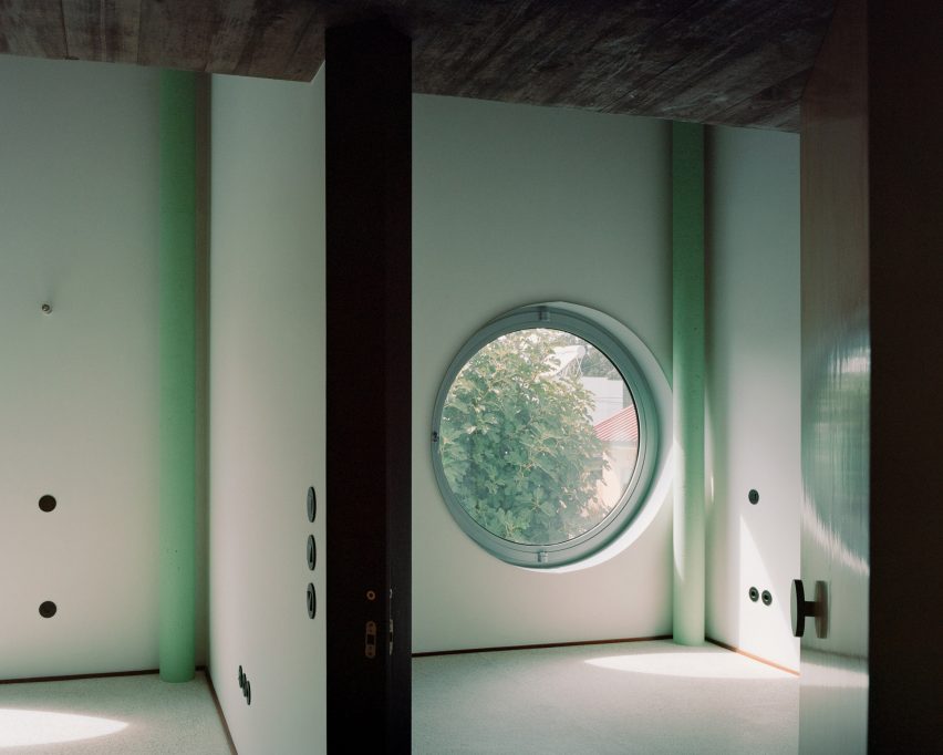 A House with an Inverted Roof by Fala Atelier