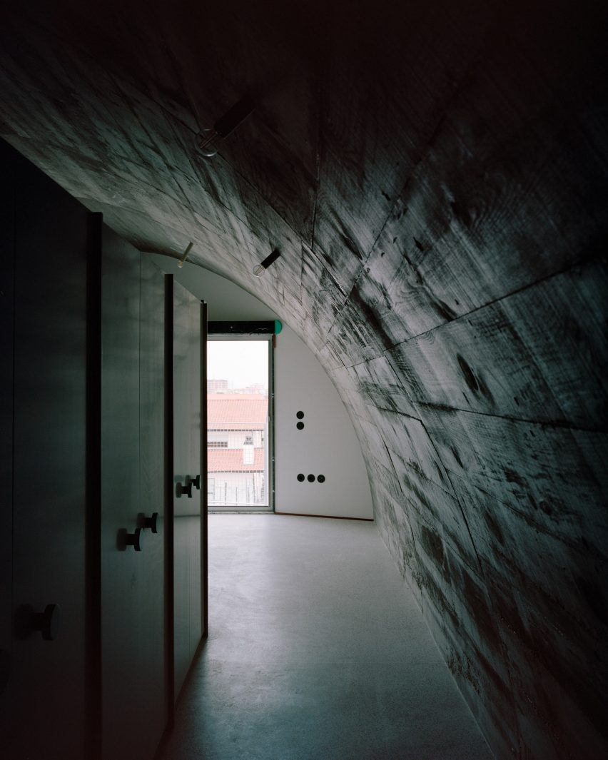 A House with an Inverted Roof by Fala Atelier