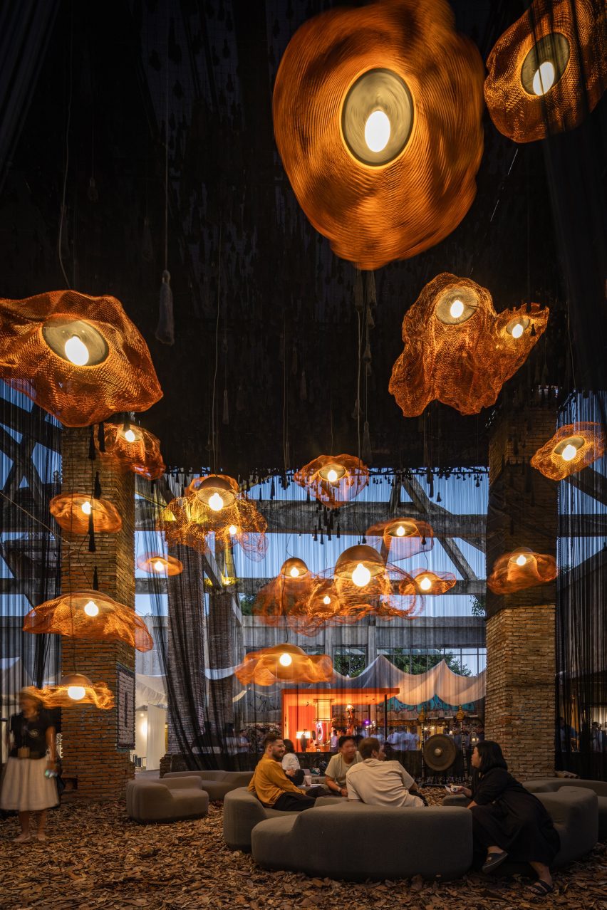 Vertical black threads create shaded lounge for Ong Cen Kuang
