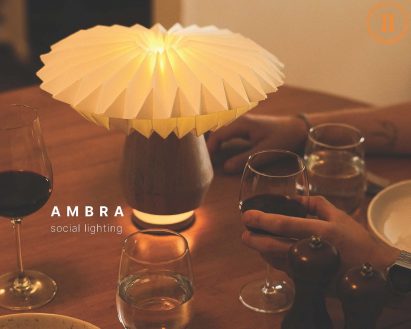 a photograph of a lamp on a dining table