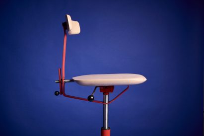 a photograph of a chair in tones of beige and red