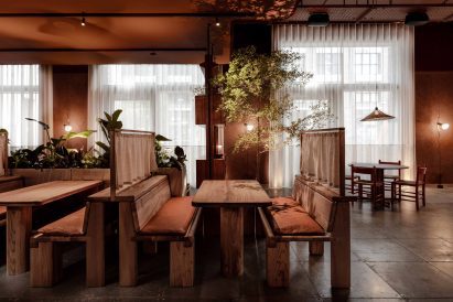 Seating booths in London restaurant by Nina + Co