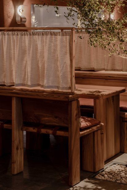 Wooden booths inside Ara restaurant