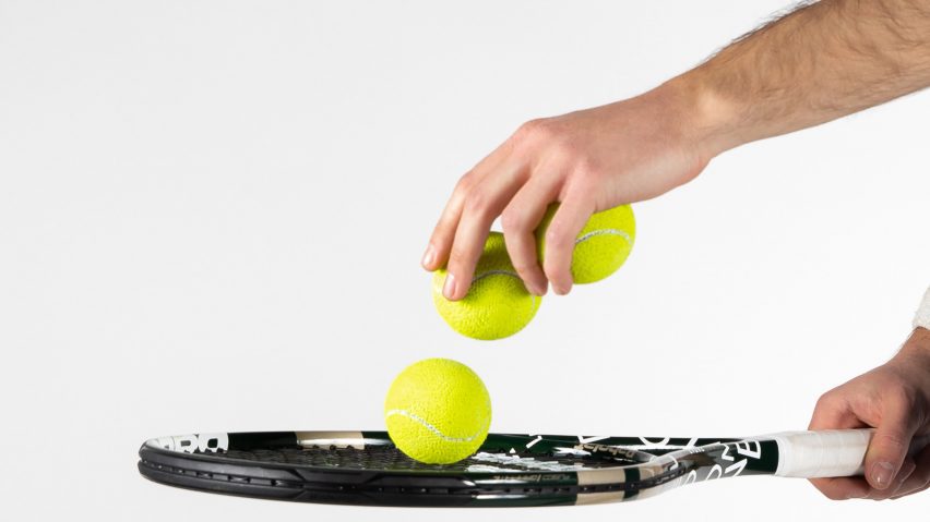Hand holding tennis balls and tennis racket