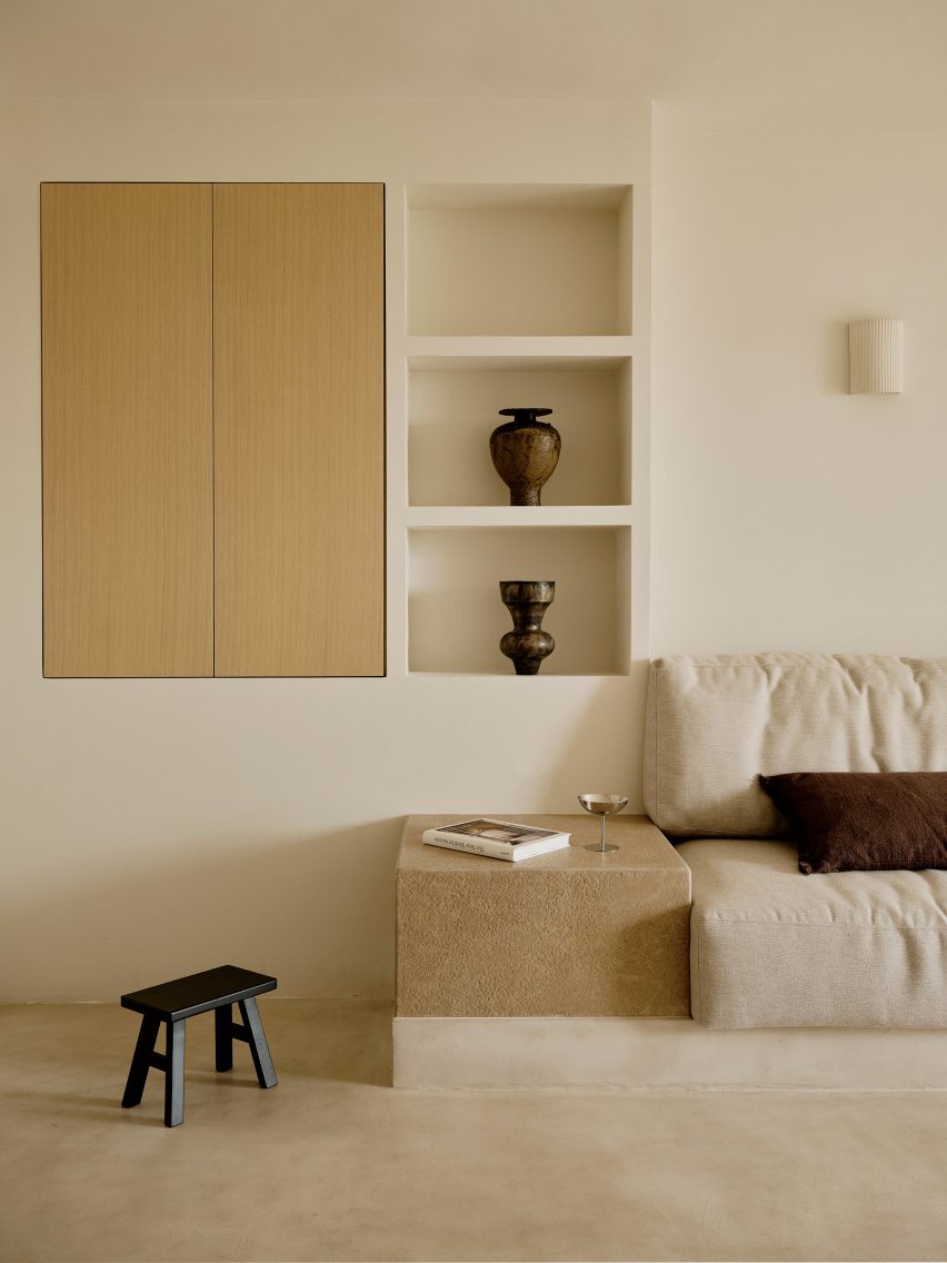 Neutrally-decorated living space with recessed shelving