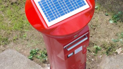 Postbox with a solar panel on its roof