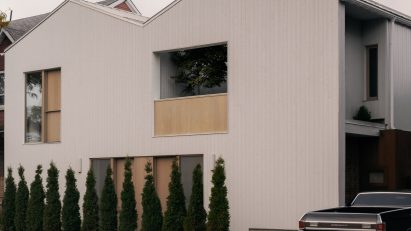 Pale cedar cladded duplex in Canada