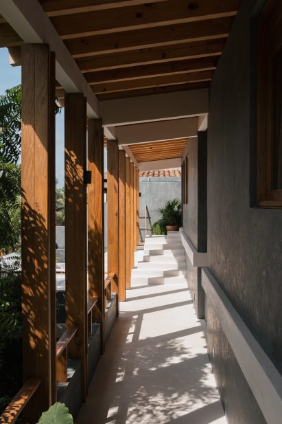 Breezeway along a dark grey chukum building