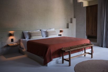 Bedroom with a stepped motif along the tops of walls