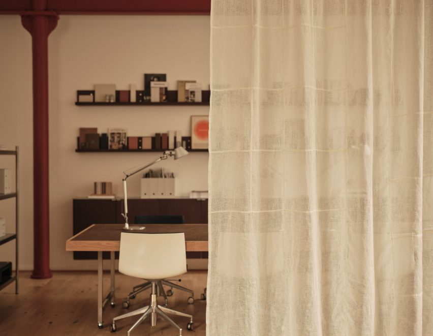 Neutral workspace with sheer curtain