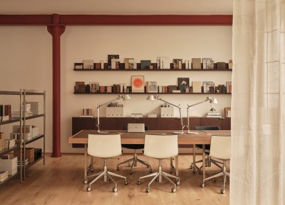 Neutral workspace with large factory windows