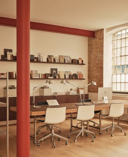Neutral workspace with large factory windows
