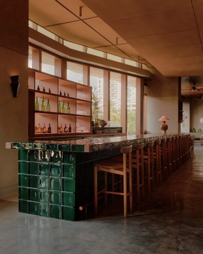 Bar is built from deep blue-green glass blocks