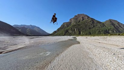 Man flying on Airbike over small river