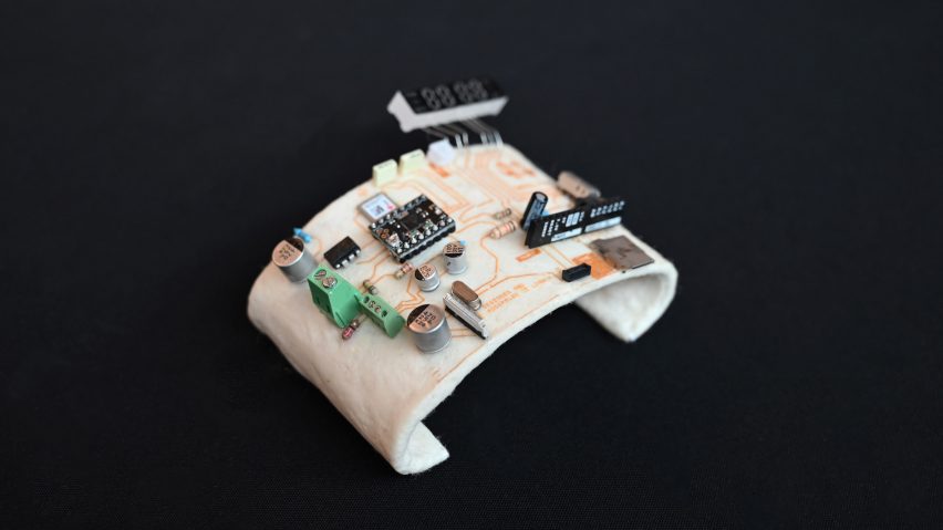 Photo of a WoolTech circuit board moulded into a rounded, cuff-like shape