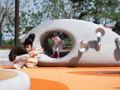 Child playing at Boulder Park by XISUI Design