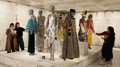 Mannequins on display with colourful costumes