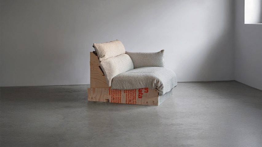 Photo of wooden and textile sofa