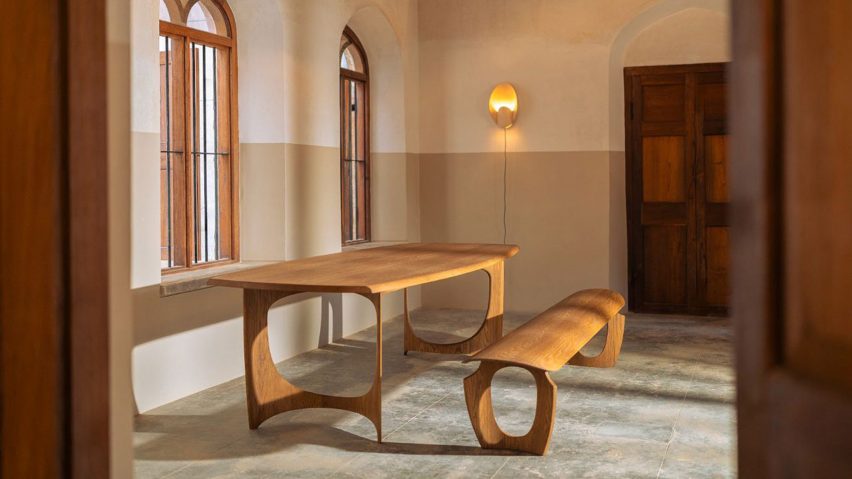 Photo of a wooden curved table and bench