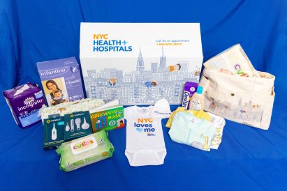 NYC Baby Box featuring nappies, wipes and a baby vest