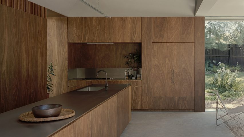 Timber kitchen featuring appliances by Fisher & Paykel