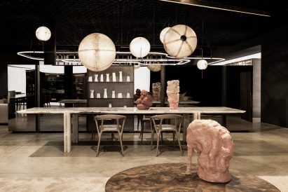 The showroom featuring the sculptural Superb-All Horizontal light by Massimo Castagna