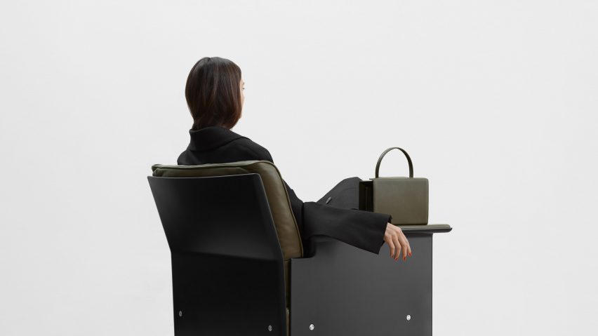 Photo of person sat on a chair, facing away